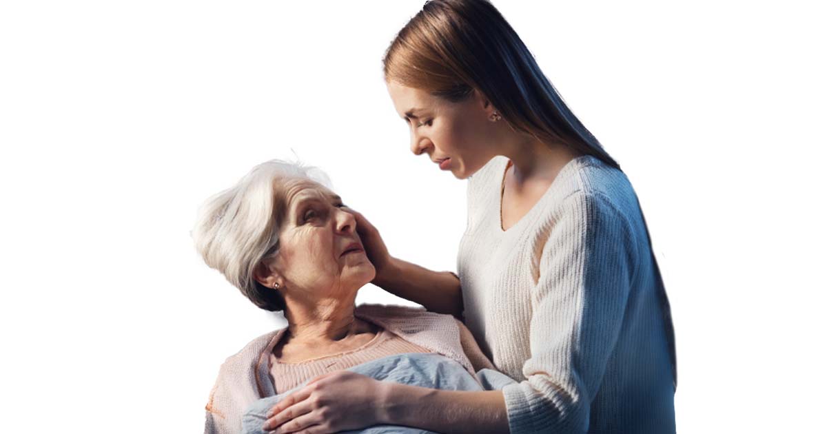 Woman touching left side of a senior citizen's head and comforting her