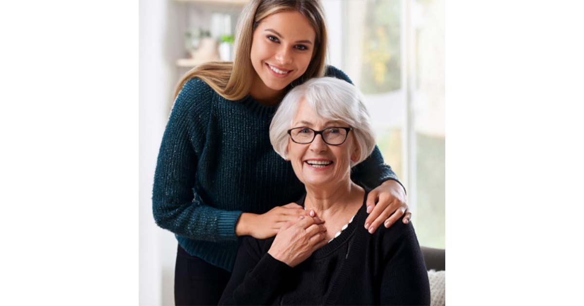 Older woman being comforted by a younger woman