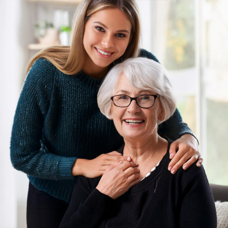 Older woman being comforted by a younger woman